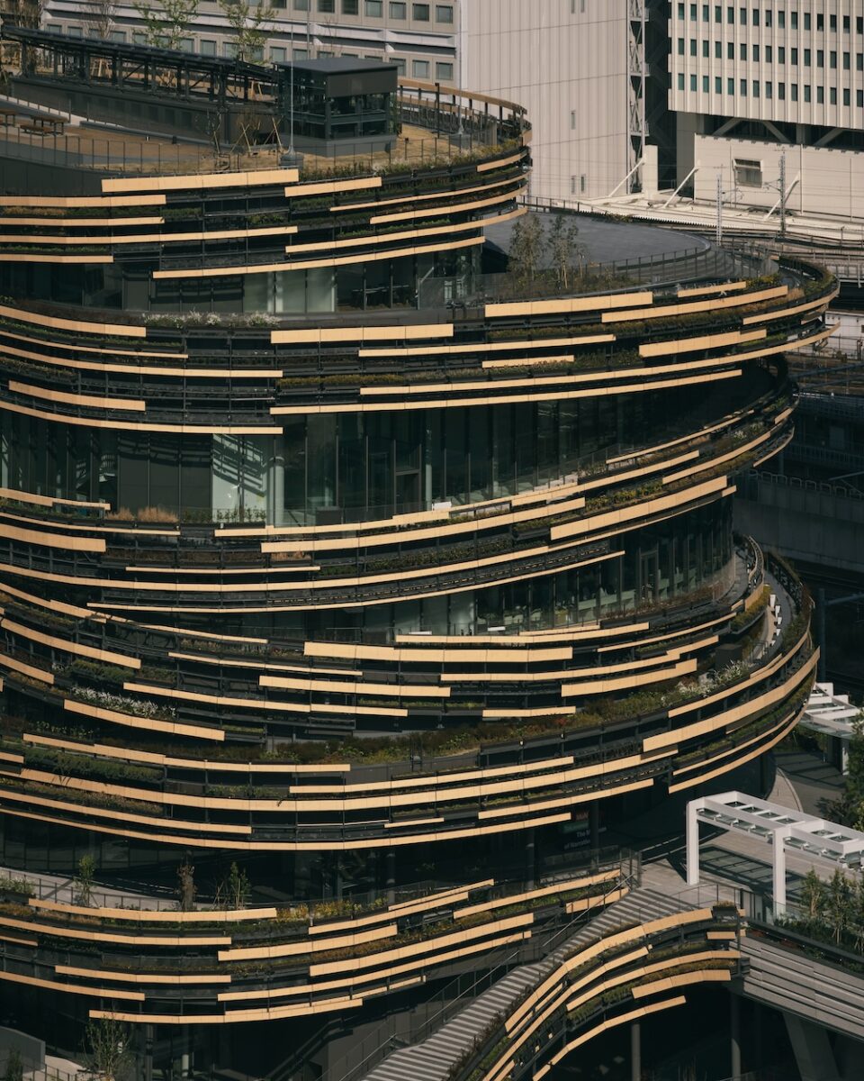 Exterior of MoN Takanawa Museum featuring Kengo Kuma’s spiral wooden design.