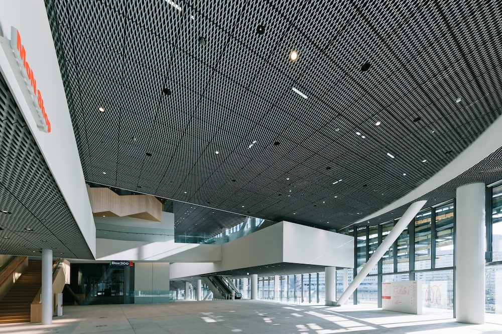 Exterior of MoN Takanawa Museum featuring Kengo Kuma’s spiral wooden design.